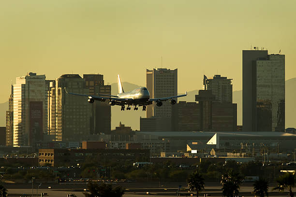 istock Jet descending into Sky Harbor Airport at Sunset. 585159402