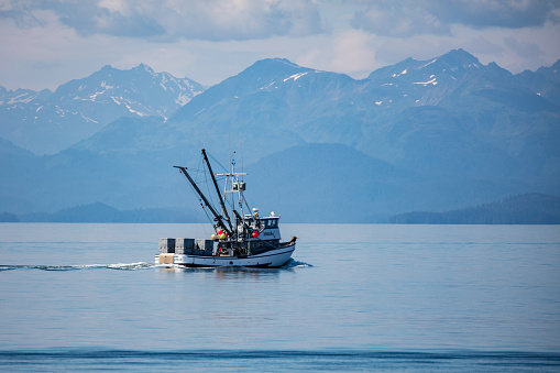 Juneau, Alaska, USA- July 12, 2016: A fishing trawler cruise sails the Inner Passage of Alaska.