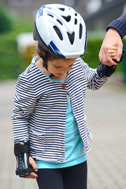 istock Little girl learning skating 585159826