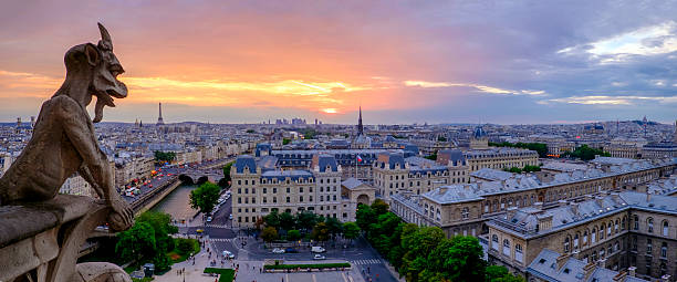 istock Sunset over Paris. Notre Dame Cathedral tower. 585161830