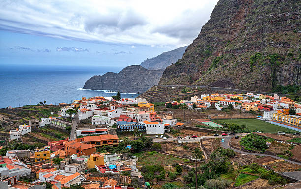 Gomera View Agulo town buildings banana plantation Tenerife island Teide volcano background, La Gomera, Canary Islands. agulo stock pictures, royalty-free photos & images