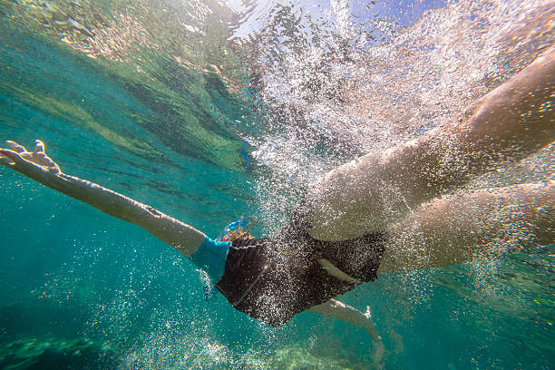 istock Woman free diving 585162904
