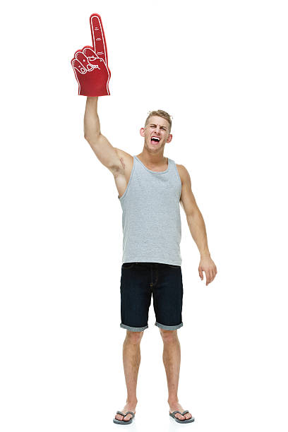 istock Casual man cheering with foam finger 585163148
