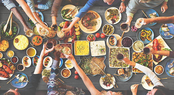 istock Friends Happiness Enjoying Dinning Eating Concept 585165560