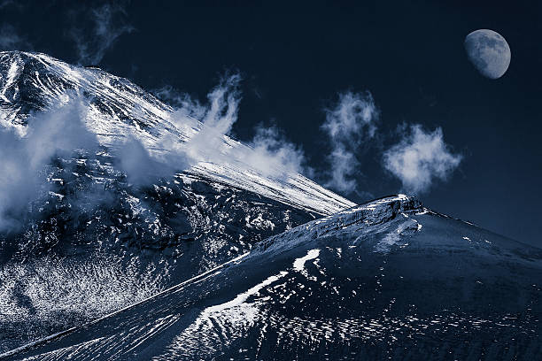 istock The snow mountain and the moon. 585168366
