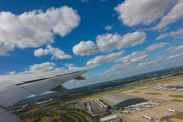 London, United Kingdom - July 5, 2016: An editorial stock photo taken from a Air Plane window above London, Heathrow. British Airways planes can be seen below. Photographed using the Canon EOS 5DSR. 