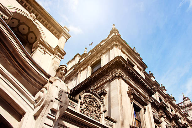 Neoclassical Old English Stonework Facade with Sculpture Pediments