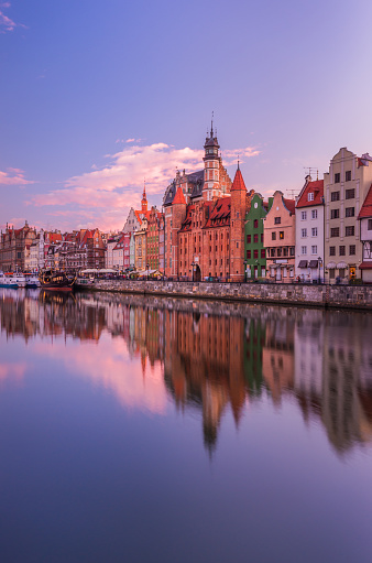 Gdansk historical waterfront over Motlava river on colorful evening