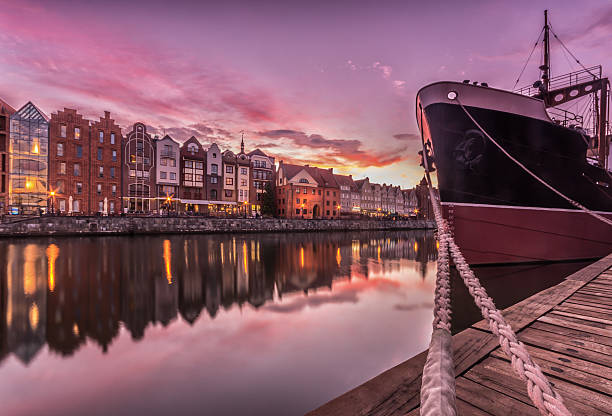 istock Colorful evening sky over Gdansk waterfront and anchored ship 585171674