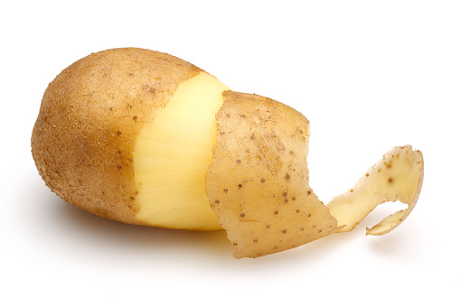 Peeled potatoes isolated on white background
