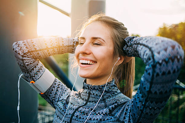 istock Sportswoman smiling at sunlight 585174410