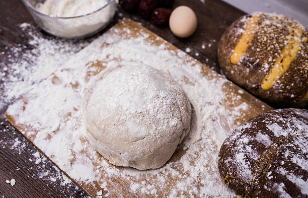 The dough on a wooden table