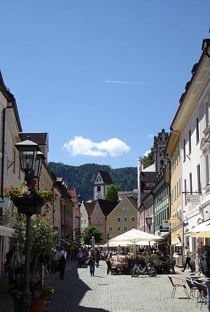 istock Busy day in Fussen with pavement cafes and shoppers 585175082