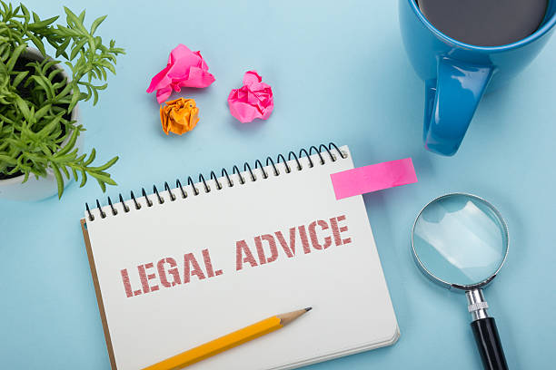 istock Legal Advice. Notepad with message, coffee cup, pen and flower 585177058