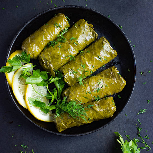 istock Dolma, stuffed grape leaves with rice and meat 585177162