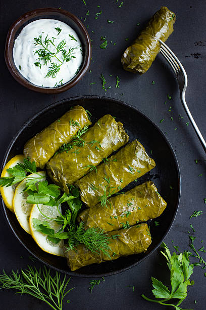 Dolma, stuffed grape leaves with rice and meat stock photo