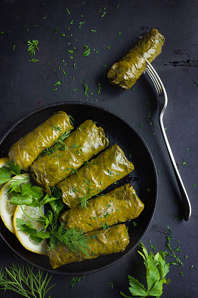 istock Dolma, stuffed grape leaves with rice and meat 585177810