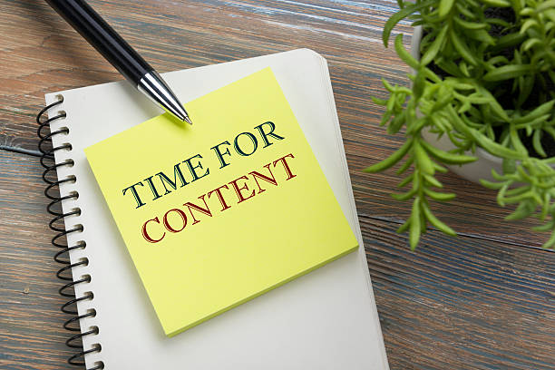 Content, online concept. Notepad with message, pen and flower. Office