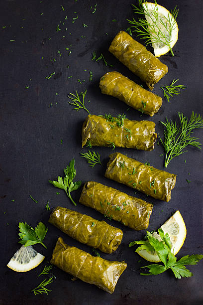 dolma, stuffed grape leaves with rice and meat - dolmades imagens e fotografias de stock