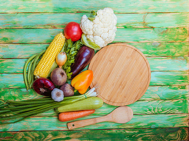 istock Fresh vegetables on a wooden table. Background. Healthy lifestyle 585181038