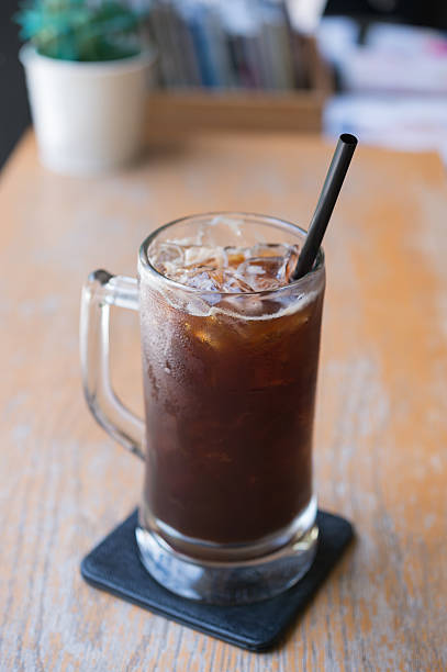 istock Iced Americano black coffee on a wooden table 585181610
