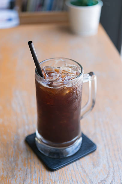 istock Iced Americano black coffee on a wooden table 585181658