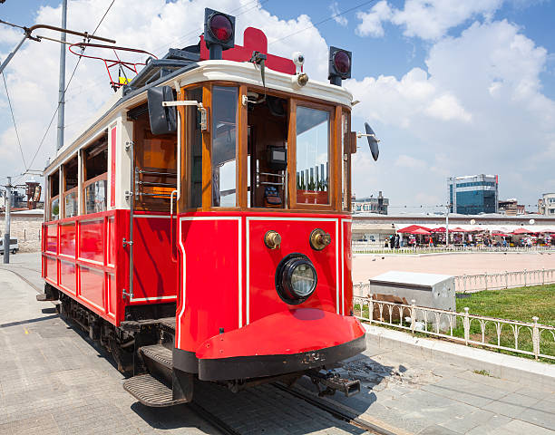 istock Old red tram goes on Taksim square 585181802