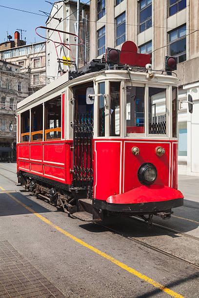 istock Old red tram goes on Istiklal street 585181870