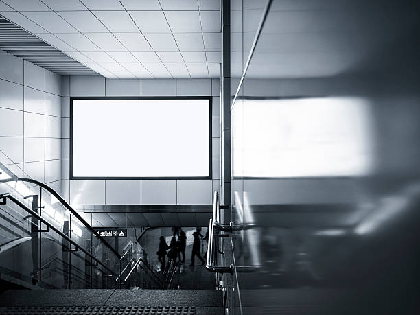 istock Billboard Banner Blank signage Media display in subway with stai 585182524