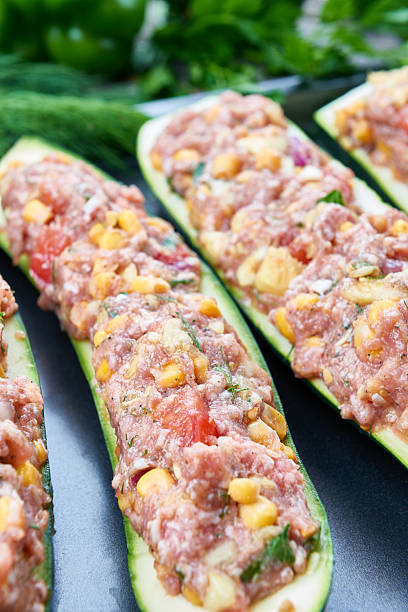 istock Raw courgettes stuffed with meat and vegetables 585182812