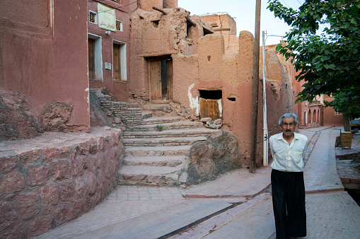 Masuleh, Iran - July 27, 2014: Iranian senior man wating in front of his traditional house.