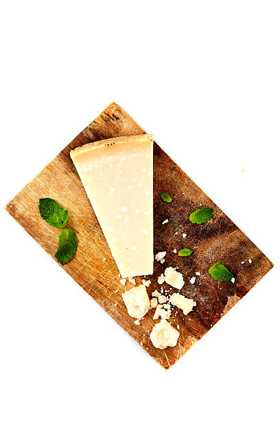 istock Piece of a parmesan and grated cheese 585185084