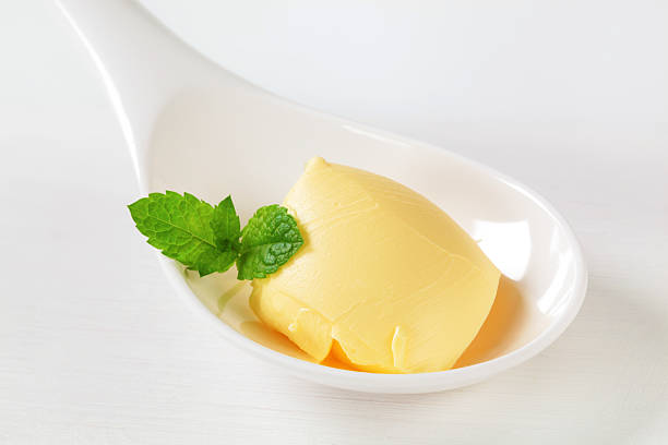 istock butter curl on spoon 585185858