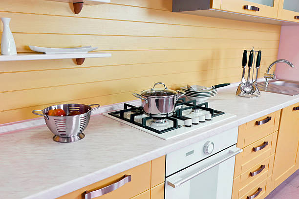 istock Luxurious new beige  kitchen with modern appliances 585185980