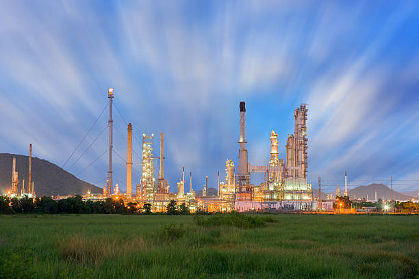 istock Twilight scene of oil refinery plant. 585187614