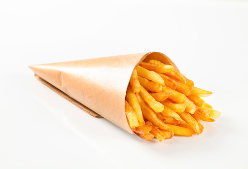 paper cone of french fries on white background