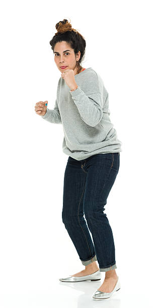 Woman in fighting stance Woman in fighting stancehttp://www.twodozendesign.info/i/1.png fighting stance stock pictures, royalty-free photos & images