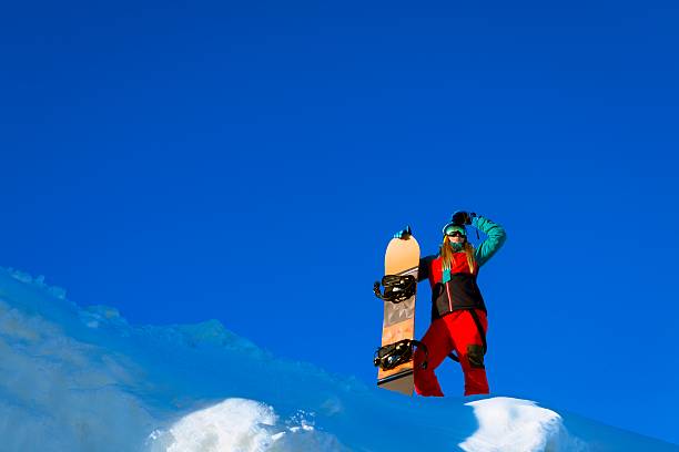 istock Woman with snowboard 585192240