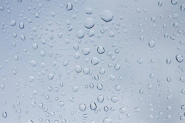 istock Drops of rain on glass , rain drops on clear window 585281874