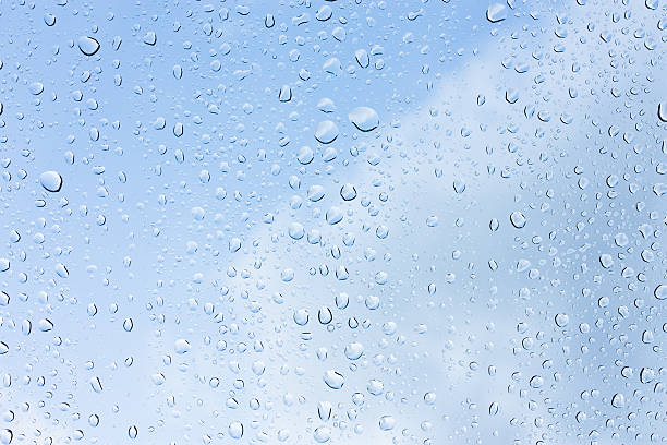 istock Drops of rain on glass , rain drops on clear window 585281884