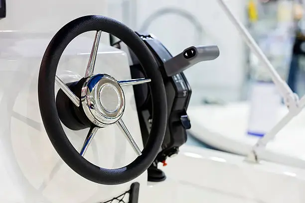 new powerful leather-chrome steering wheel for boat;  note shallow depth of field