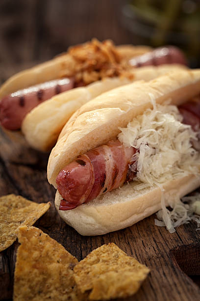 istock Hot dogs on wooden table with copy space 585283448