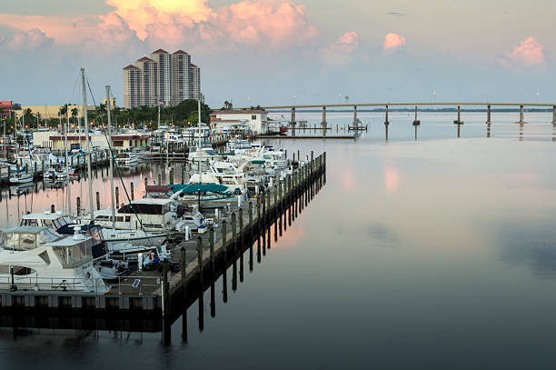 View of Downtown Fort Myers, Florida at Sunrise Vew of boat dock downtown Fort Myers Florida. fort myers photos stock pictures, royalty-free photos & images
