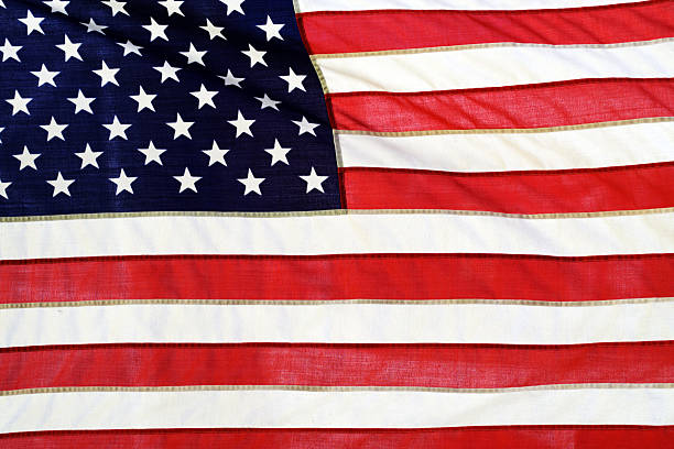 istock American flag flowing in the wind 585288100
