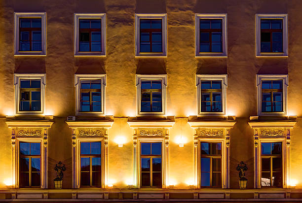 istock Windows on night facade of office building 585288230