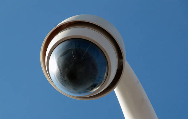 istock Street CCTV Road Security Camera Against Blue Sky 585288824