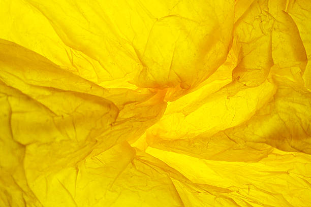 istock Texture of yellow striped crumpled paper for pattern background 585290054