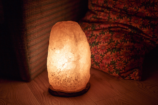 Salt lamp on the floor of the house