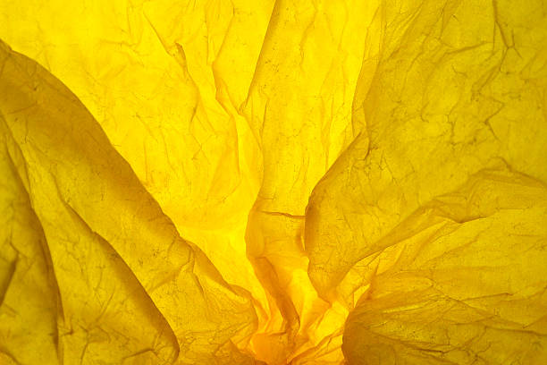 istock Texture of yellow striped crumpled paper for pattern background 585290138