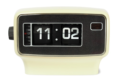 Vintage flip alarm clock on white background